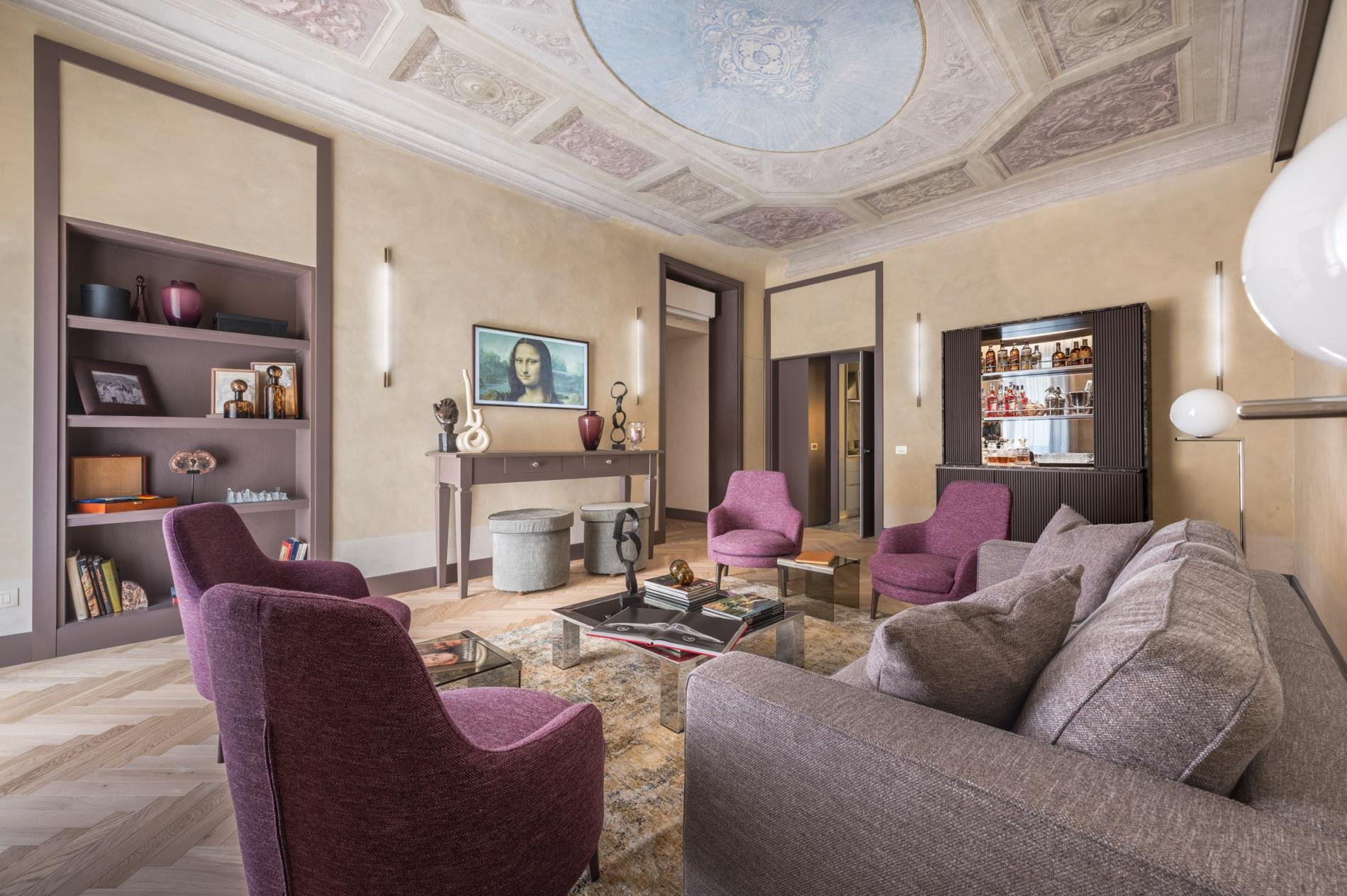 Formal living room with frescoed ceiling at the Belcortese apartment in Florence