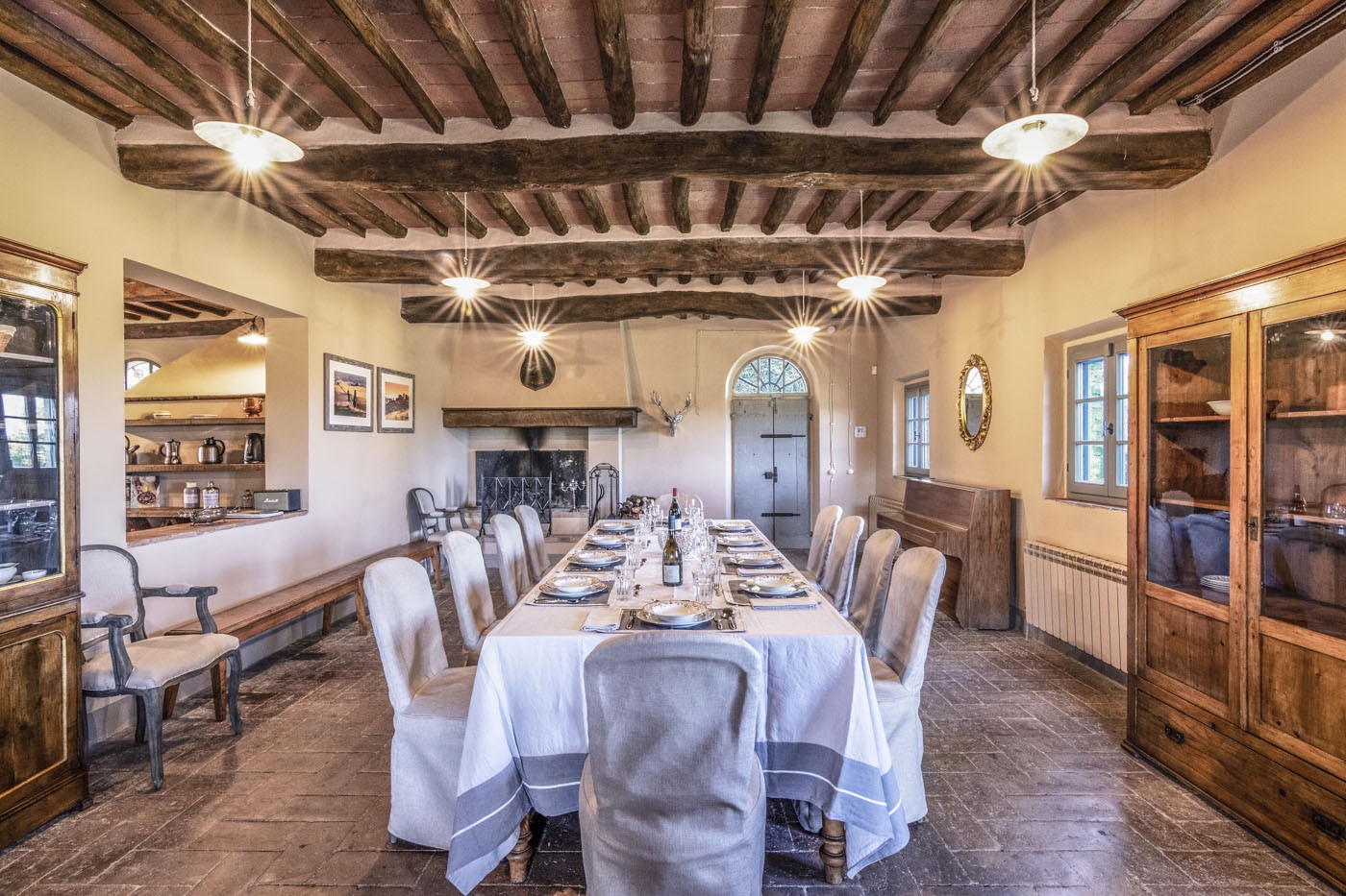 Long dining table set for a shared meal at Villa Distinta